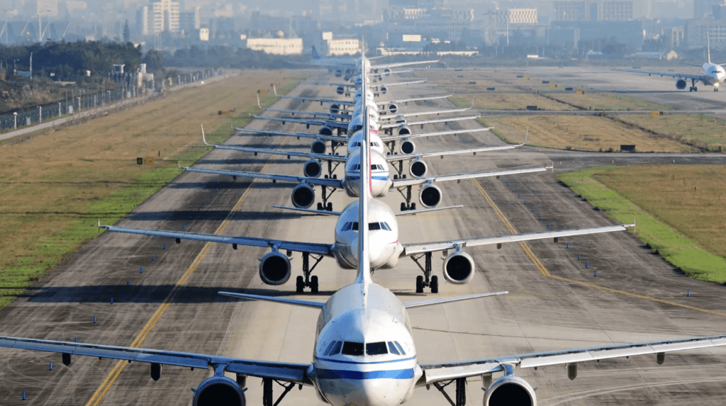 airliners lining up on taxiway for takeoff